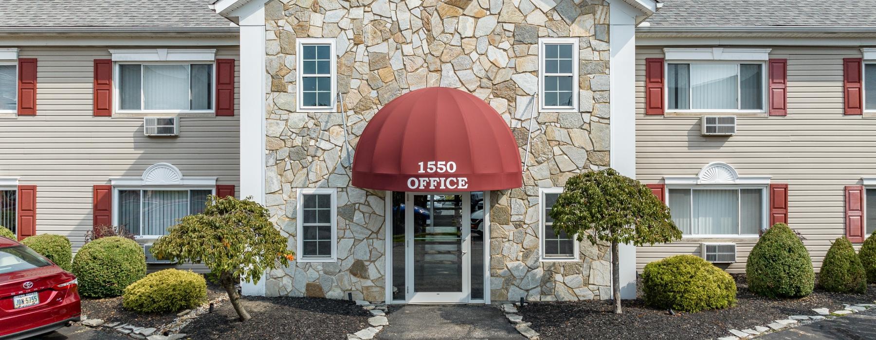 a building with a red awning