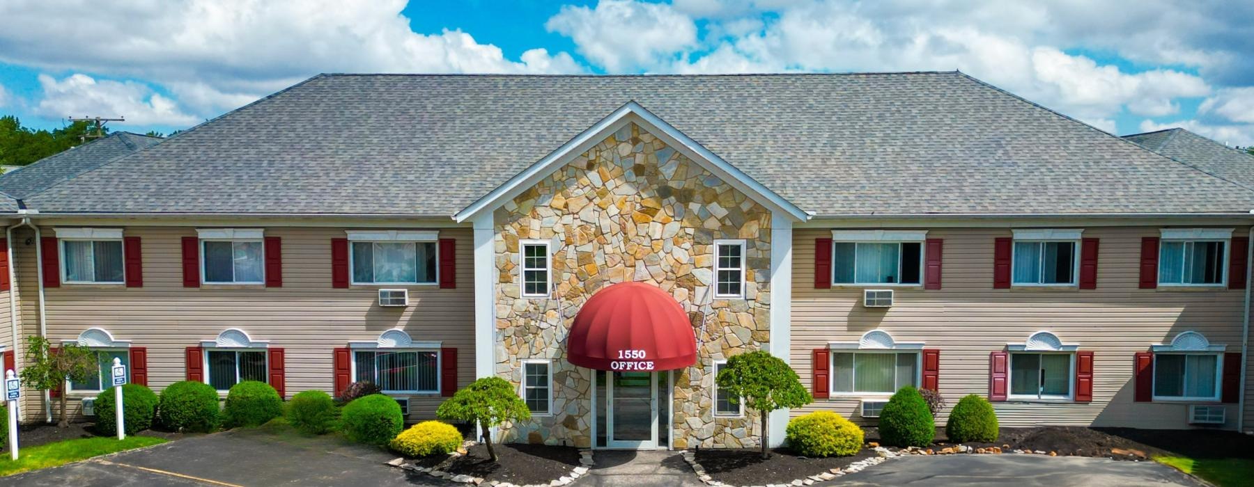 a building with a red awning