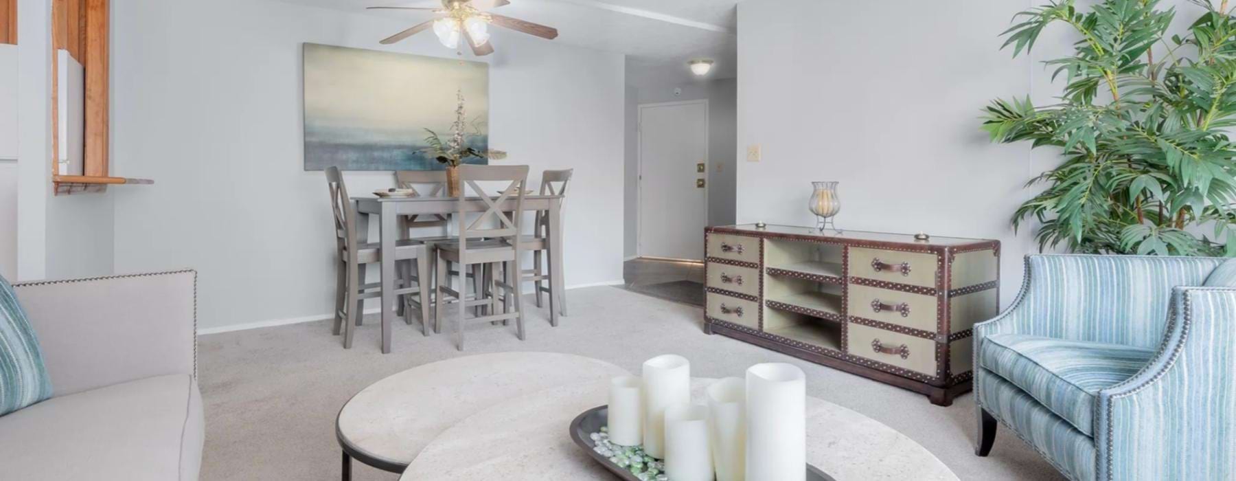 a living room with a table and chairs